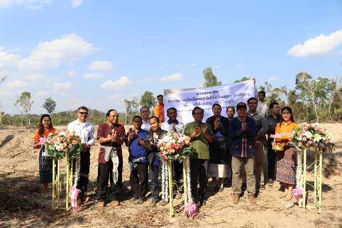 Lane Xang Minerals Limited Sepon hands expanded rice paddies to villagers next to Sepon Mine.